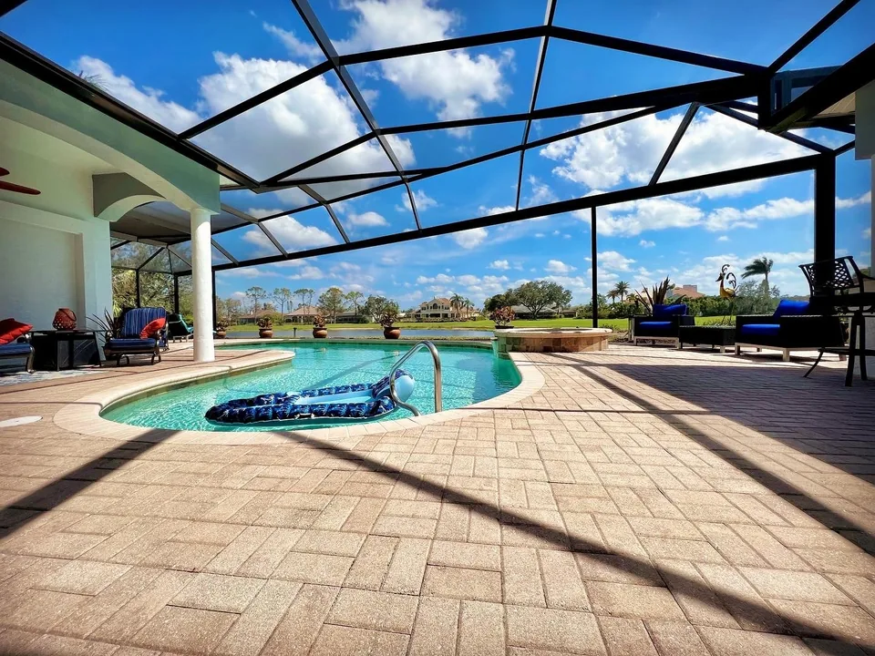 Hendry Aluminum screen enclosure around a Fort Myers residential pool