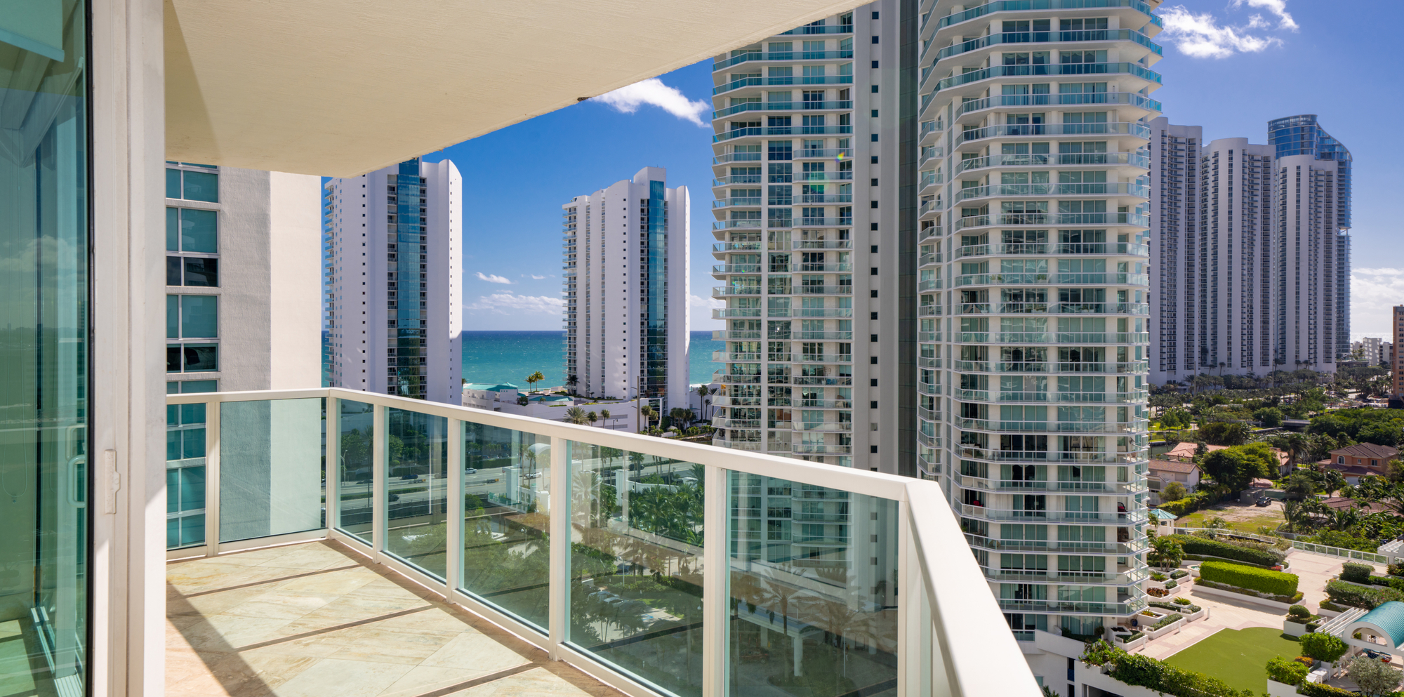 Apartment condominium flat balcony with view of coastal building