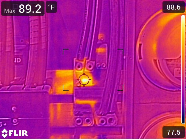 Infrared thermography on a 400 A service entrance and meter reveals localized hot-lug connections—required imaging for Florida building recertification compliance.